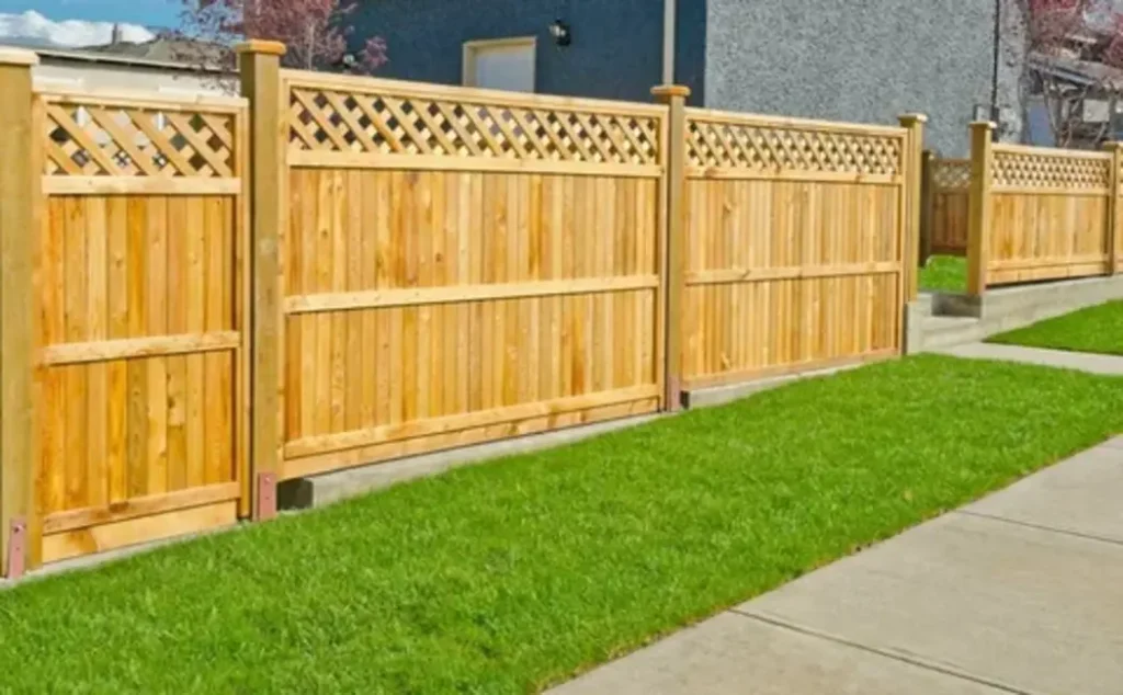 Elegant custom fence design with decorative panels, enhancing curb appeal and property boundaries.