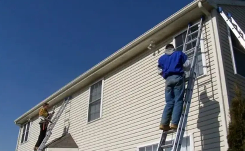 A residential home with professionally installed vinyl siding, completed by expert exterior siding contractors.