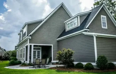 Home exterior featuring clean and durable vinyl panels installed through professional siding services.