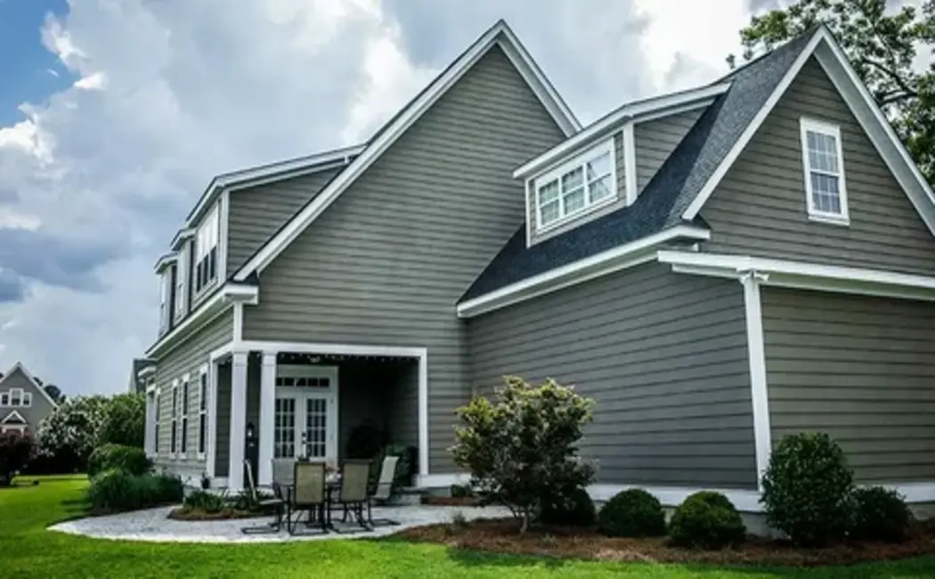 Home exterior featuring clean and durable vinyl panels installed through professional siding services.