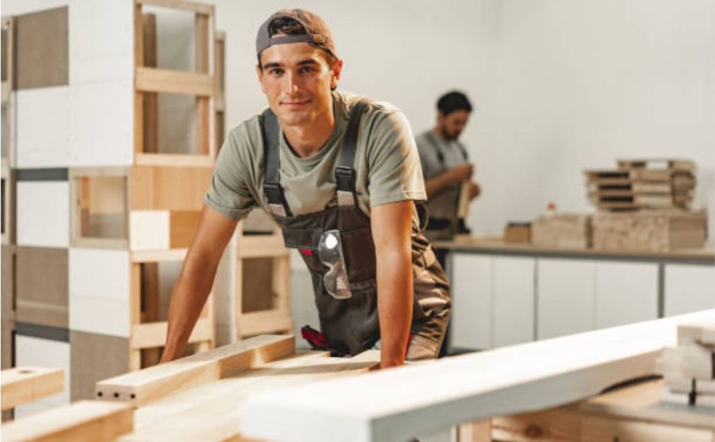 Woodworker standing in a carpentry workshop
